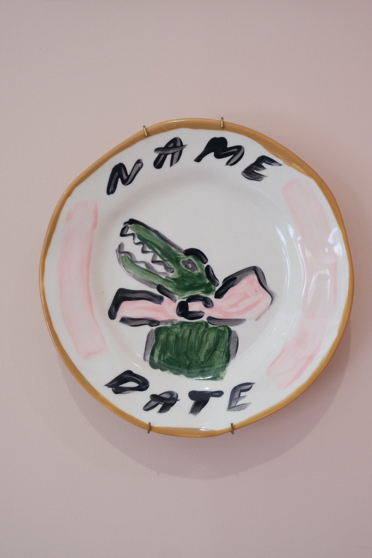 Close up of personalised pink crocodile plate by Tatiana Alida Design