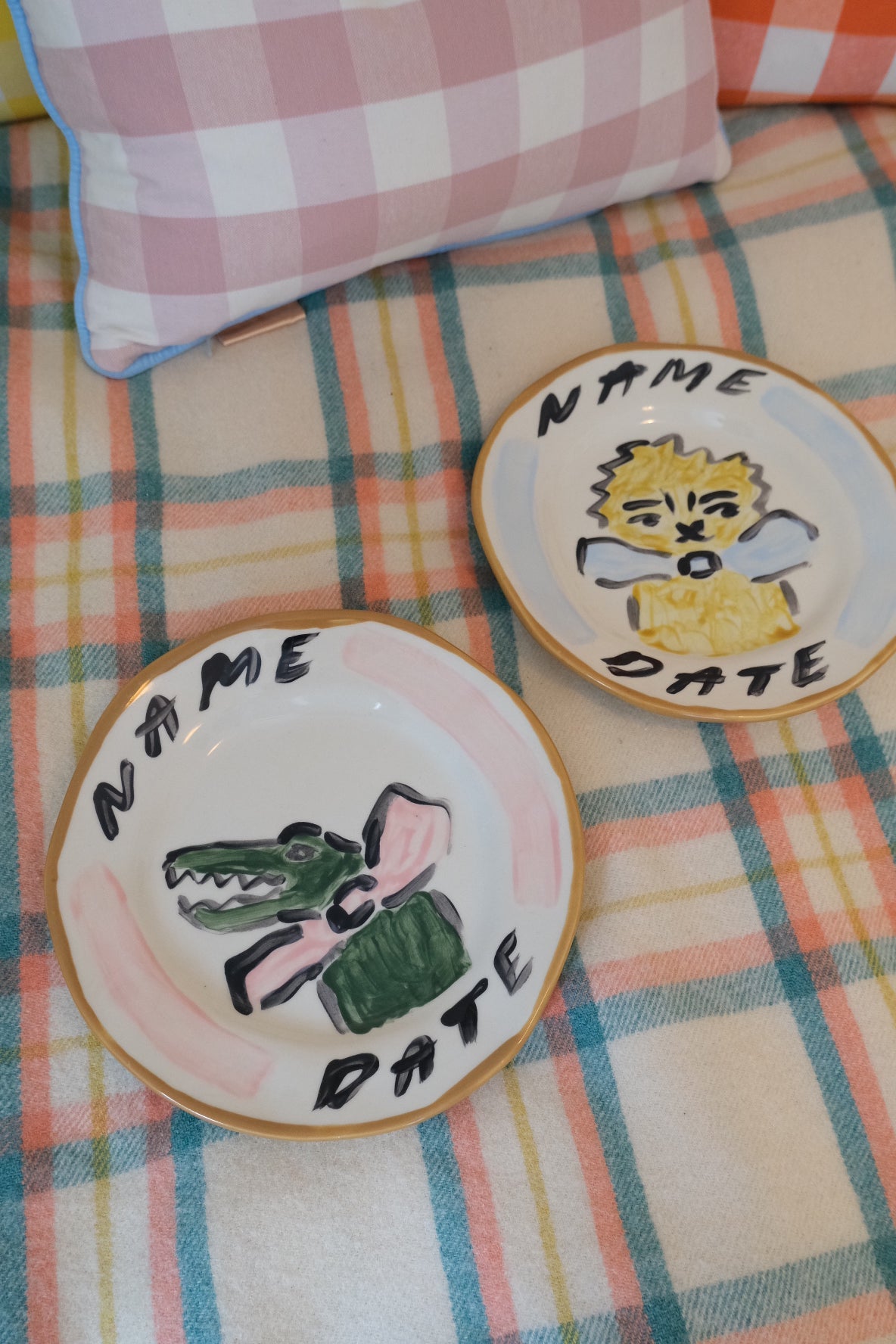 Pair of hand painted ceramic animal plates by Tatiana Alida Design