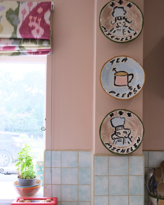 Decorative, hand-painted plates that are perfect for display in the kitchen - by Tatiana Alida