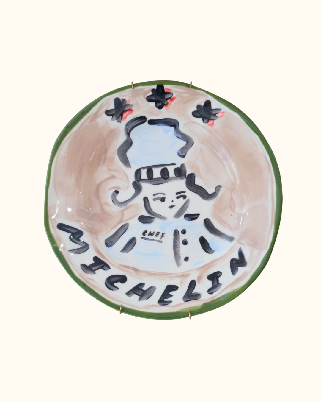 Hand-painted ceramic decorative plate with a michelin star chef