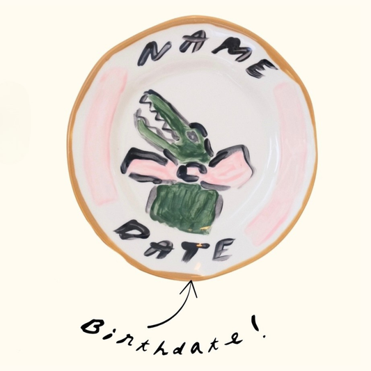 Close up of personalised pink crocodile plate by Tatiana Alida Design, personalised baby present 