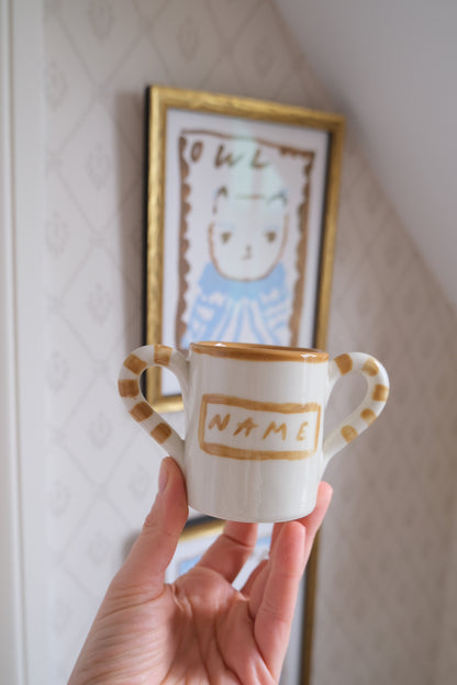 Personalised baby mug in white and beige ceramic