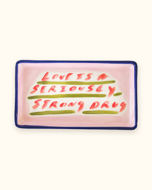 Love Is A Seriously Strong Drug hand-painted ceramic tray by Tatiana Alida