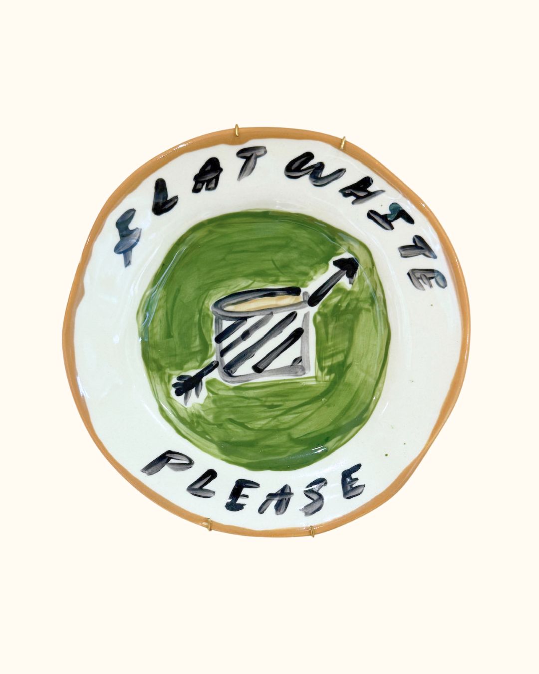 Ceramic plate with flat white coffee by Tatiana Alida